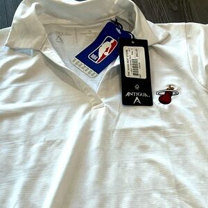 Antiqua from NBA store. White collared dry fit . NWT. Miami Heat w small